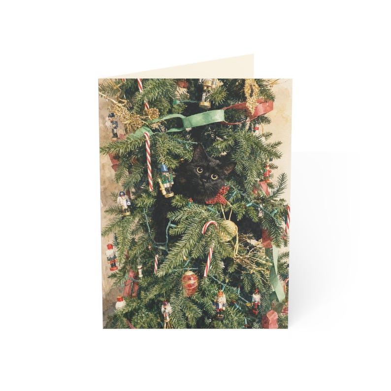 Etsy listing mockup: Black cat nestled in a decorated Christmas tree on a greeting card