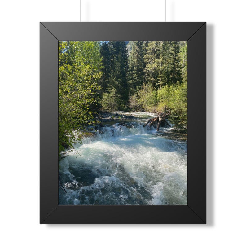 Etsy listing mockup: Whitewater cascading through a sunlit evergreen forest in a black frame